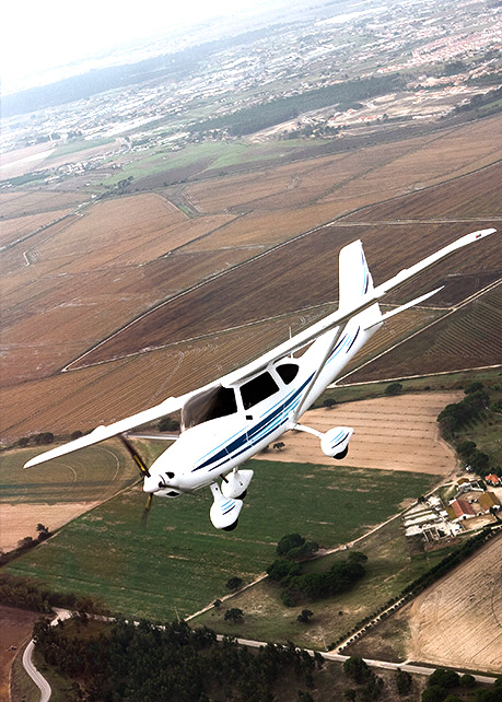 Plane flying over houses.